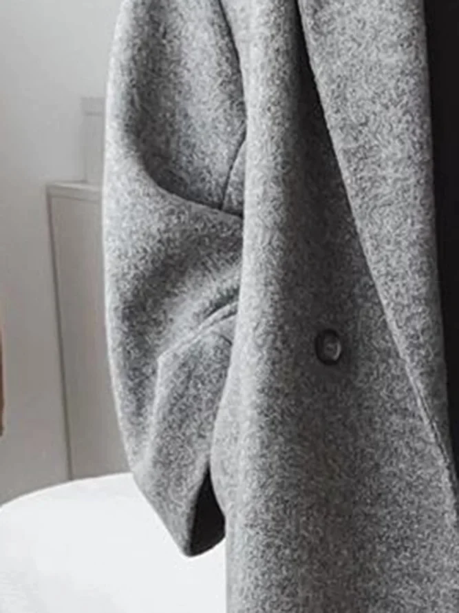 Abrigo largo oversized de doble botonadura con solapas anchas para mujer 5